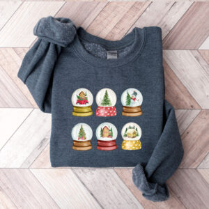 vintage christmas sweatshirt with snowglobe design for women comfortable crewneck style for holiday celebrations and festive outfits ipmtw