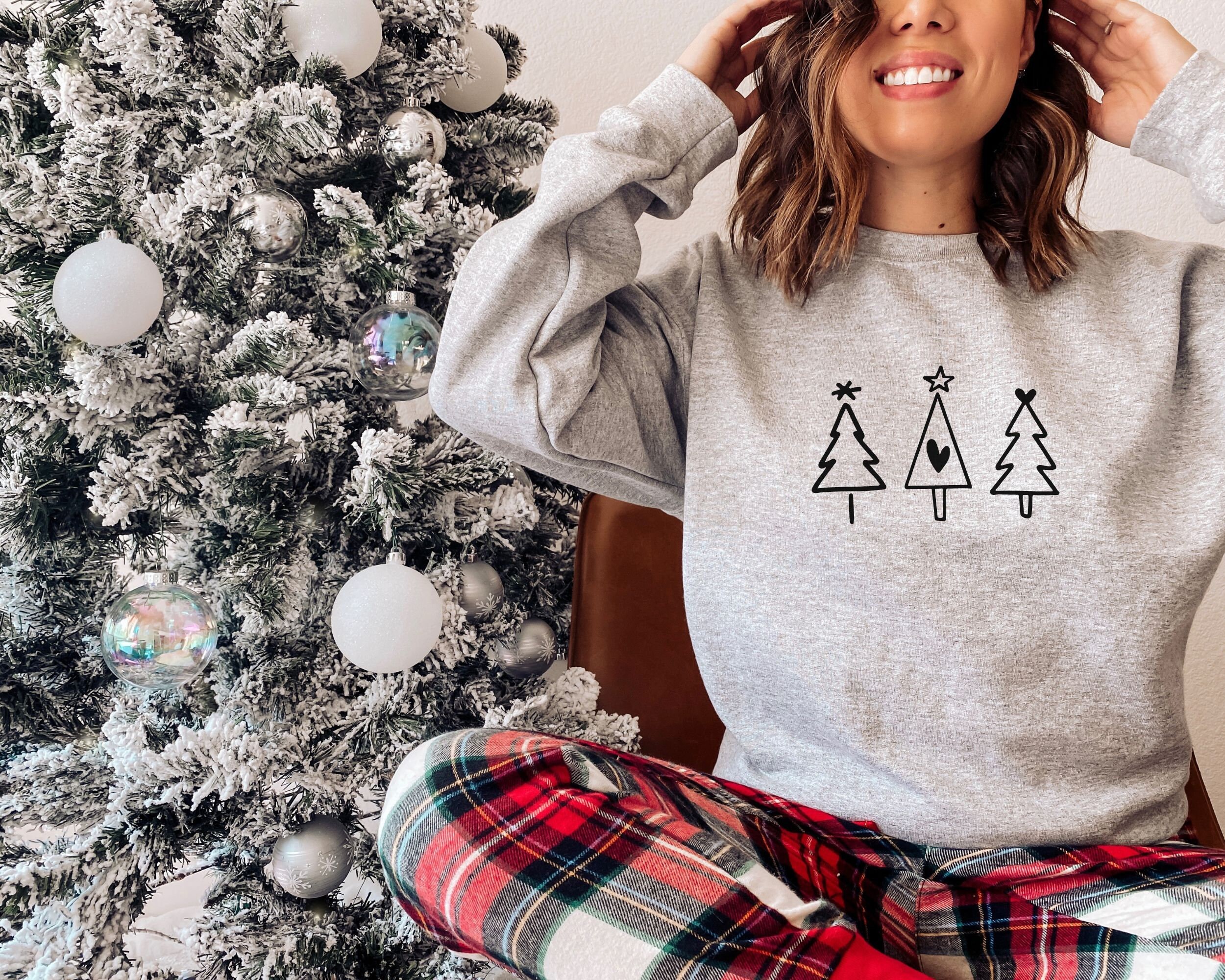 vintage christmas sweatshirt with tree drawing for women minimalist crewneck for holiday season and boho style