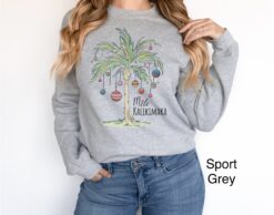 vintage christmas sweatshirt with tropical palm tree design for beach vacation and family gatherings mele kalikimaka theme uzxko