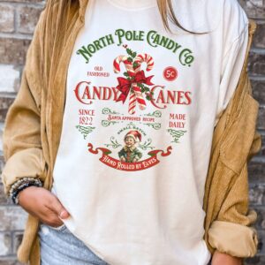 vintage christmas t shirt featuring retro candy cane design for nostalgic holiday style and north pole inspired look uqimk scaled