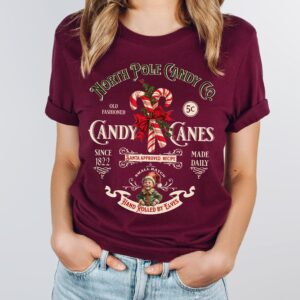 vintage christmas t shirt featuring retro candy cane design for nostalgic holiday style and north pole inspired look wnk2k