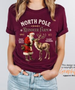 vintage christmas t shirt featuring retro santa and reindeer design for a fun holiday look at the north pole imc7i scaled