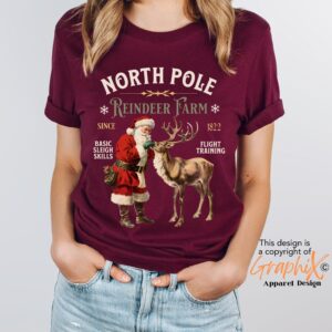 vintage christmas t shirt featuring retro santa and reindeer design for a fun holiday look at the north pole imc7i scaled