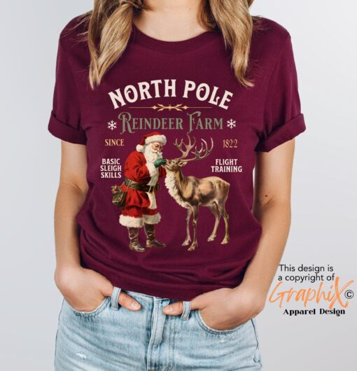 vintage christmas t shirt featuring retro santa and reindeer design for a fun holiday look at the north pole imc7i scaled