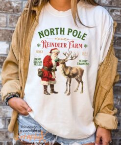 vintage christmas t shirt featuring retro santa and reindeer design for a fun holiday look at the north pole nxtyi scaled