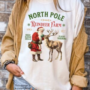 vintage christmas t shirt featuring retro santa and reindeer design for a fun holiday look at the north pole nxtyi scaled