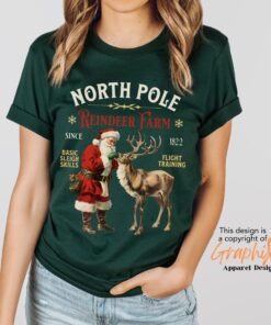 vintage christmas t shirt featuring retro santa and reindeer design for a fun holiday look at the north pole uj2bb scaled