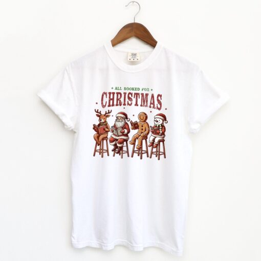 vintage christmas t shirt for book lovers featuring holiday reading design and festive literary theme vnxow scaled