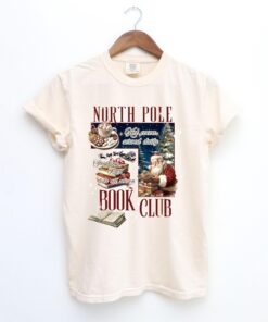 vintage christmas t shirt for book lovers north pole book club design funny santa t shirt for holiday celebrations hhkbp scaled