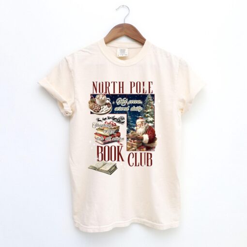 vintage christmas t shirt for book lovers north pole book club design funny santa t shirt for holiday celebrations hhkbp scaled