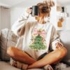 vintage christmas t shirt for women featuring a christmas tree bow design and comfortable fit for holiday celebrations xyau5 scaled