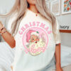 vintage christmas t shirt for women featuring retro pink santa claus design in comfort colors for family holiday celebrations brlpf