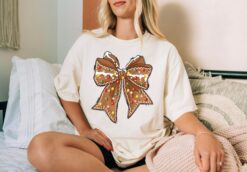 Vintage Christmas T Shirt Gingerbread Design with Bow Graphic Comfortable Colors for Holiday Celebrations and Festive Gatherings