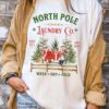 vintage christmas t shirt north pole laundry design with retro santa graphic for unique holiday style mk8a4 scaled
