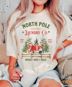 vintage christmas t shirt north pole laundry design with retro santa graphic for unique holiday style x7mcd scaled