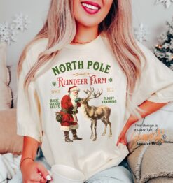 Vintage Christmas T Shirt North Pole Reindeer Design Comfort Colors Retro Style for Festive Holiday Celebrations