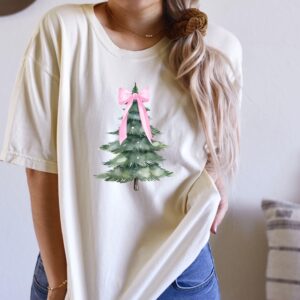 vintage christmas t shirt with pink bow design and christmas tree graphic for a fun holiday look lwdmo