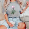 vintage christmas t shirt with pink bow design and christmas tree graphic for a fun holiday look n1ybe