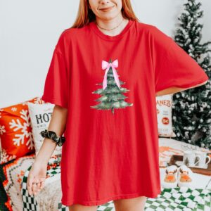 vintage christmas t shirt with pink bow design and christmas tree graphic for a fun holiday look ttqca