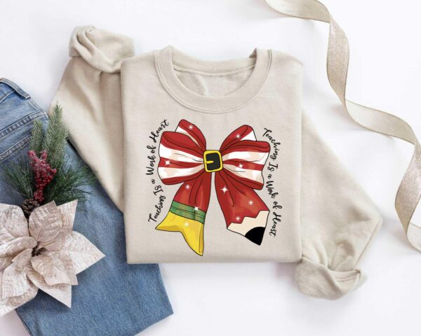 vintage christmas teacher long sleeve t shirt with bow design for educators and fun holiday wear