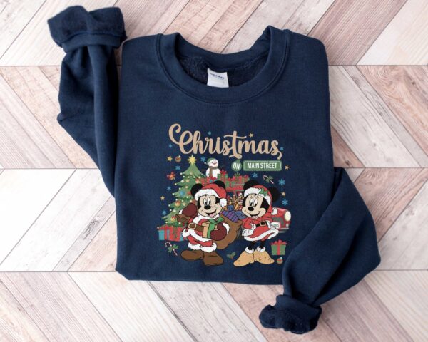 vintage disney christmas sweatshirt featuring retro mickey and minnie on main street sleigh rides for festive holiday style adadj scaled