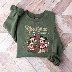 vintage disney christmas sweatshirt featuring retro mickey and minnie on main street sleigh rides for festive holiday style tmrue scaled