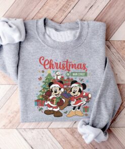 vintage disney christmas sweatshirt featuring retro mickey and minnie on main street sleigh rides for festive holiday style udp2o scaled