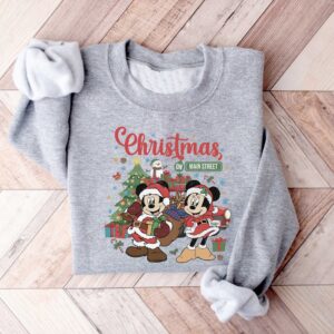 vintage disney christmas sweatshirt featuring retro mickey and minnie on main street sleigh rides for festive holiday style udp2o scaled