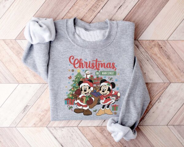 vintage disney christmas sweatshirt featuring retro mickey and minnie on main street sleigh rides for festive holiday style udp2o scaled