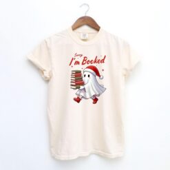 Vintage Funny Christmas Ghost T-Shirt Sorry Im All Booked Design Bookish Winter Shirt for Spooky Holiday Celebrations