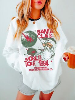 Vintage Santa World Tour Sweatshirt Unisex Retro Crewneck with Fun Santa Claus Design for Christmas Celebrations and Matching Pajamas