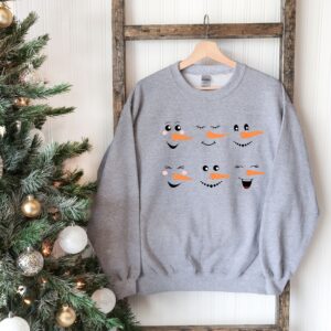 vintage snowman sweatshirt for women featuring fun snowman faces ideal for christmas and winter celebrations h7t4s