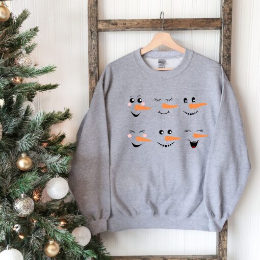 vintage snowman sweatshirt for women featuring fun snowman faces ideal for christmas and winter celebrations h7t4s scaled