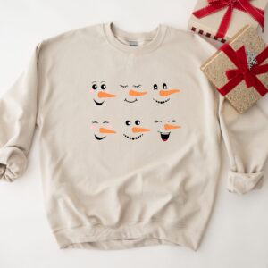 vintage snowman sweatshirt for women featuring fun snowman faces ideal for christmas and winter celebrations obqzt