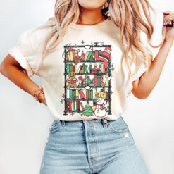 Vintage T Shirt Bookish Christmas Design for Reading Lovers in Comfort Colors Featuring Santa and Bookshelf Theme