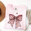 vintage t shirt comfort colors christmas tree cake tee in pink with bow design for fun holiday celebrations yndqp scaled