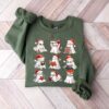 vintage t shirt featuring cute christmas ghosts reading with book lovers theme for women szgx0 scaled