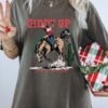 Vintage T Shirt Giddy Up Jingle Horse Cowboy Santa Graphic Tee for Christmas Holiday Rodeo Fans and Western Lovers