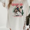 vintage t shirt giddy up jingle horse tee cowboy santa western graphic unisex christmas shirt for rodeo fans and holiday celebrations pytgk