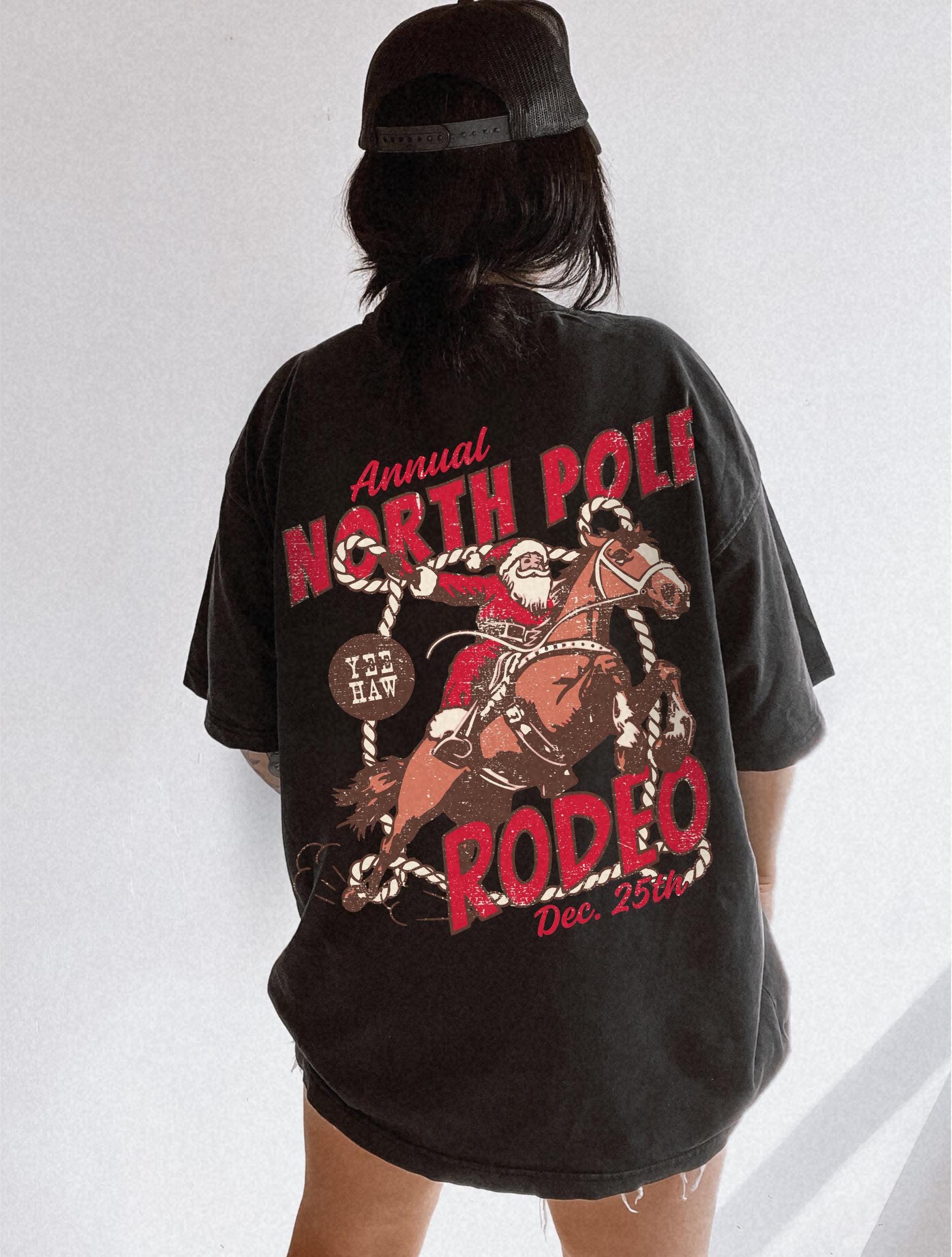 vintage t shirt north pole rodeo tee unisex cowboy santa claus design comfort colors for country christmas celebrations dd4ig