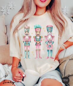 Vintage T Shirt Nutcracker Christmas Shirt Womens Holiday Tee in Pink Comfortable Colors with Fun Design for Festive Celebrations