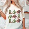 vintage t shirt western christmas cactus tree design oversized holiday tee with howdy cowboy theme for festive celebrations rdtug