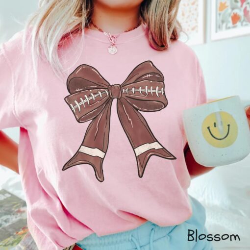 cute football mom shirt with bow design for women comfortable tee perfect for football season activities ewdfw scaled