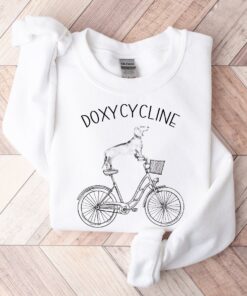 doxycycline pharmacy pun sweatshirt with dachshund on bicycle for pharmacist and veterinarian gifts jr7gy