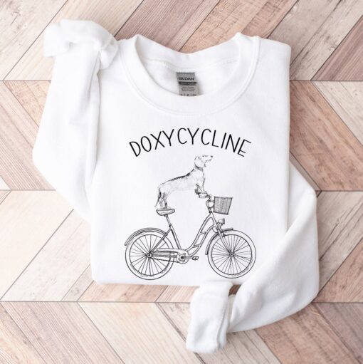 doxycycline pharmacy pun sweatshirt with dachshund on bicycle for pharmacist and veterinarian gifts jr7gy