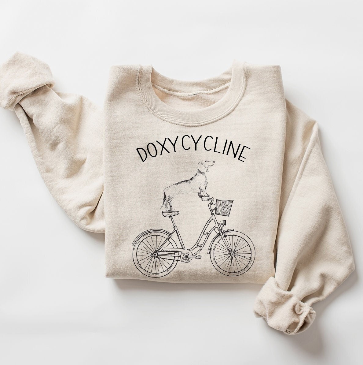 doxycycline pharmacy pun sweatshirt with dachshund on bicycle for pharmacist and veterinarian gifts