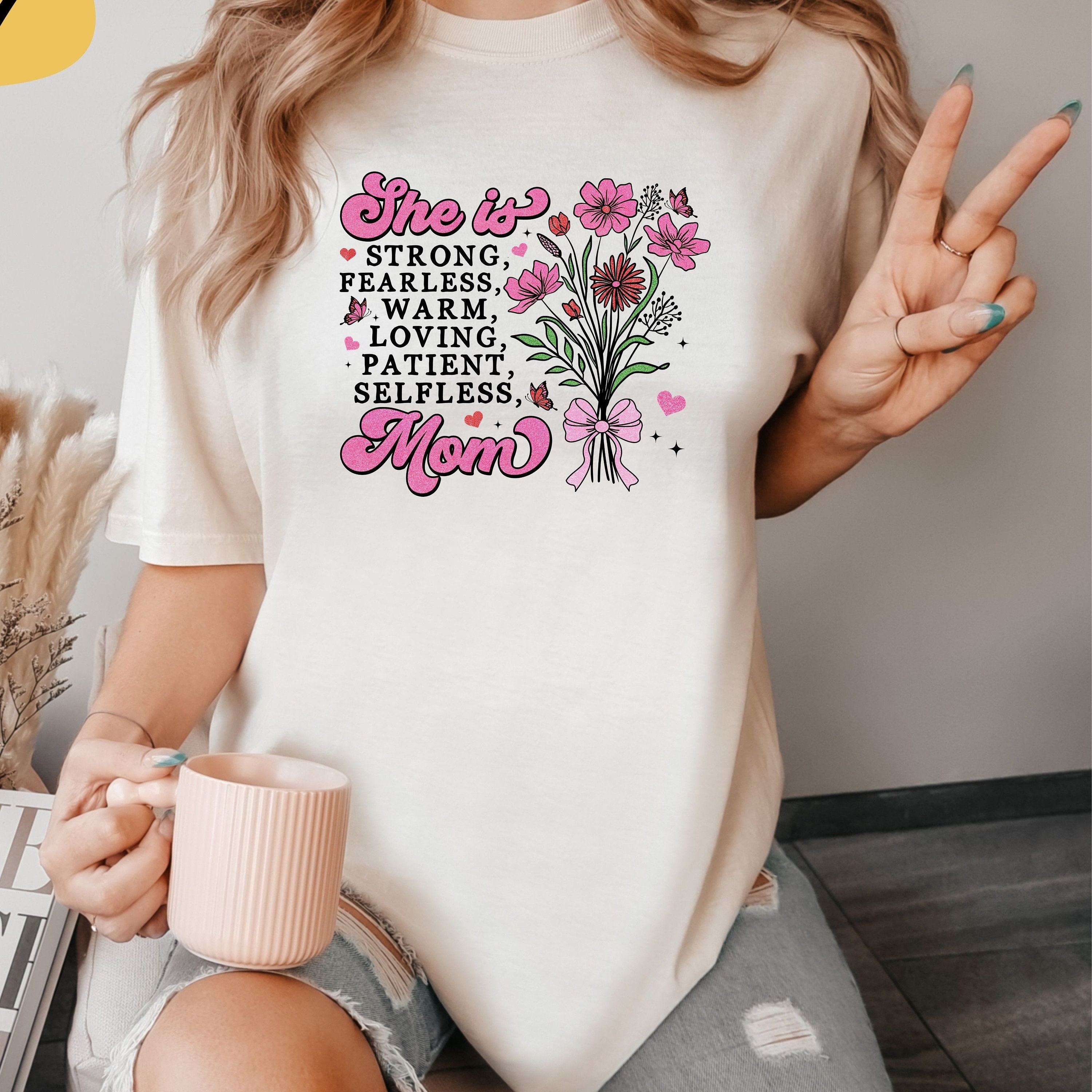 she is loved strong selfless fearless mom t shirt cute floral design best mom shirt for mothers day gifts somuz scaled