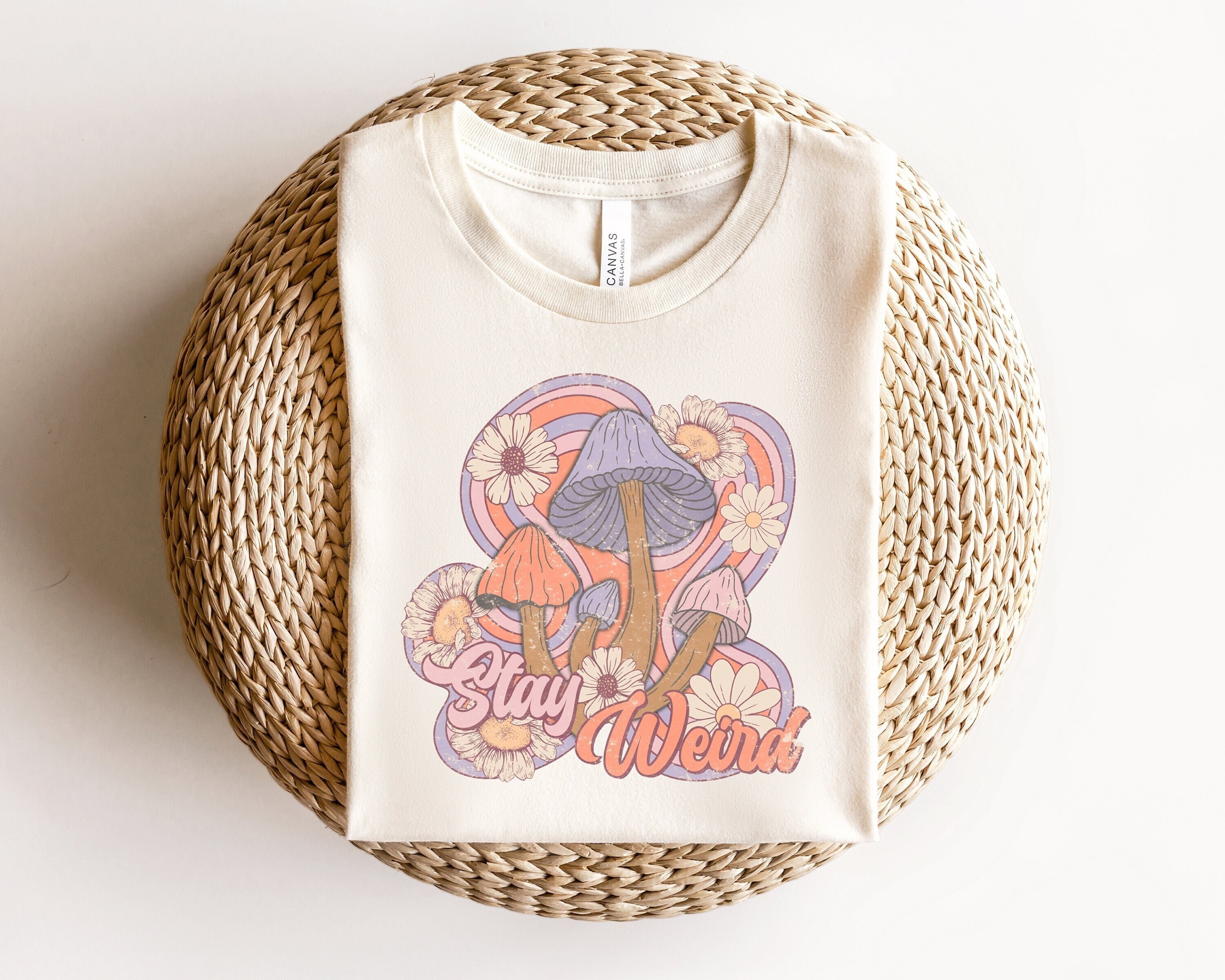 stay weird retro t shirt with boho mushroom design and floral print for unique hippie style gqa6m scaled