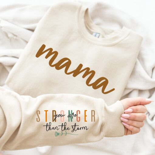 stronger than the storm mama sweatshirt with positive quotes for new moms best mom ever shirt na2c3 scaled