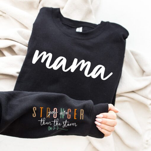 stronger than the storm mama sweatshirt with positive quotes for new moms best mom ever shirt ubo2d scaled